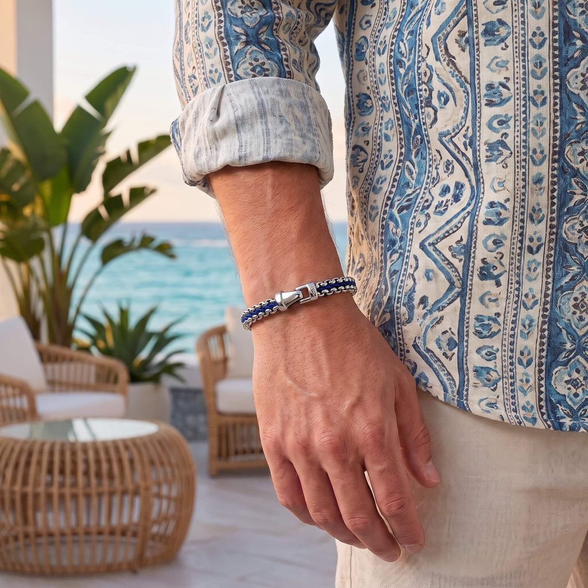 Men's navy blue and steel chain bracelet worn on the wrist, showing how the Anchor Chain sits against the skin